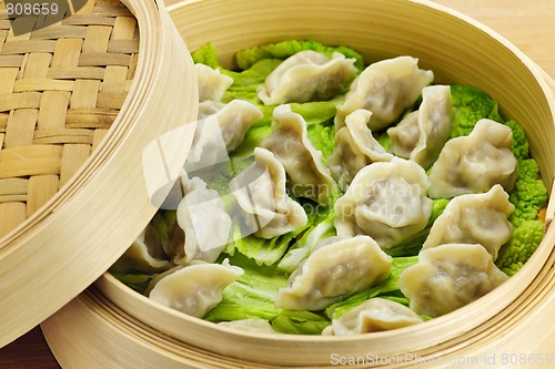 Image of Bamboo steamer with dumplings
