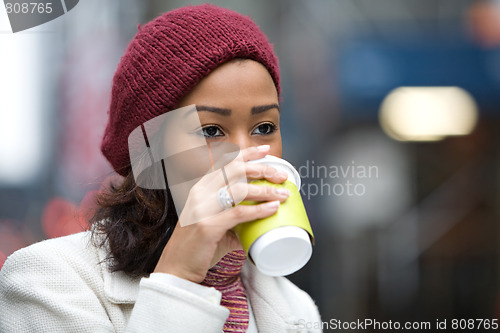 Image of Woman Drinking a Hot Beverage