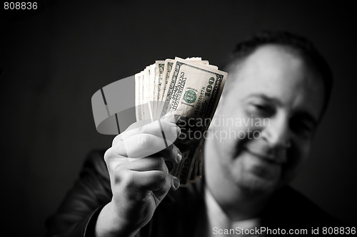 Image of Man Holding Cash