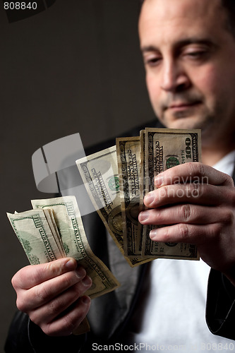 Image of Man Counting Cash