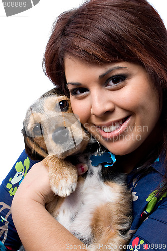 Image of Woman Cuddling a Puppy