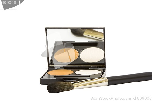 Image of make-up box with powder and brush isolated in white