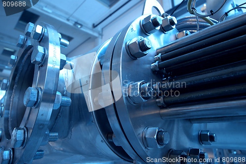 Image of Pipes, tubes, machinery and steam turbine at a power plant