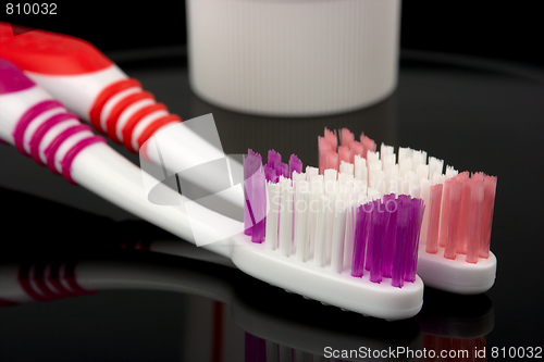 Image of Two toothbrushes and toothpaste