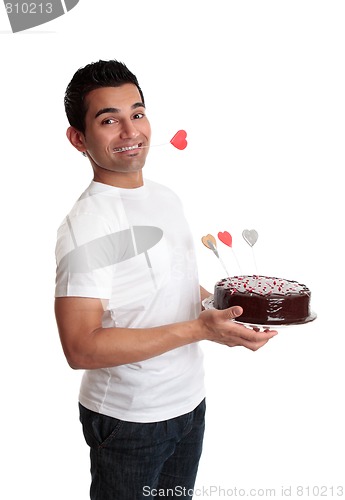 Image of Cheeky man with a love heart cake