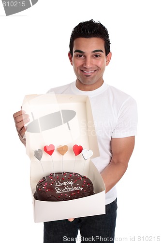 Image of Adult man holding a chocolate birthday cake