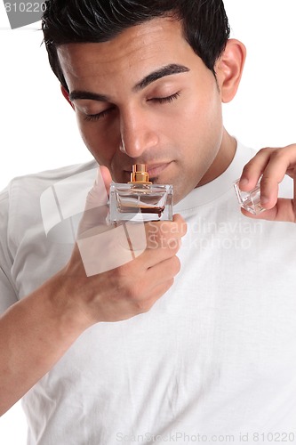 Image of Man smelling perfume