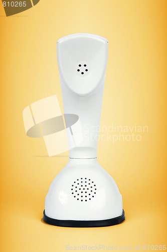 Image of Retro telephone isolated on orange
