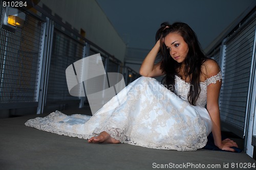 Image of Beautiful bride sitting on floor