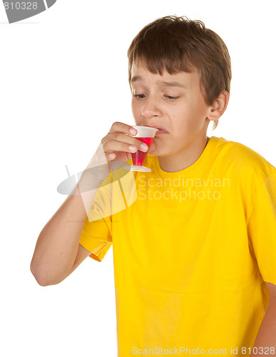 Image of boy drinking medicine on white