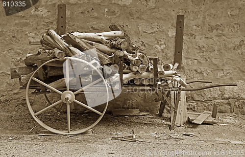 Image of old cart with logs