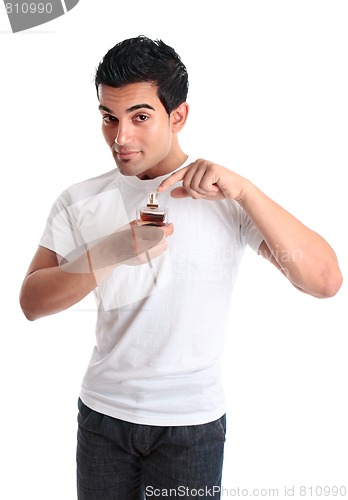 Image of Man pointing to a bottle of perfume