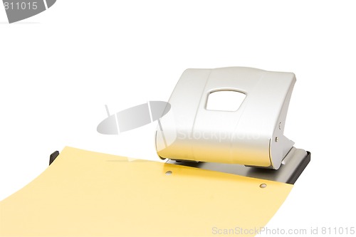 Image of hole puncher at work isolated