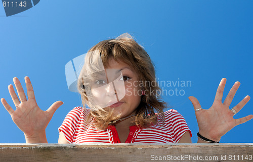 Image of Young beautiful girl shows palm