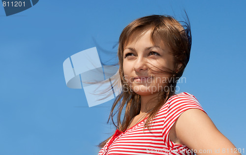 Image of Girl on background blue sky