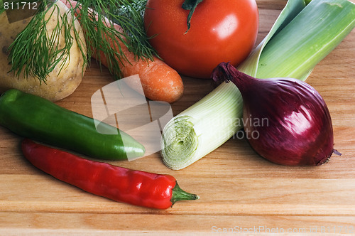 Image of  vegetables  on a wooden kitchen board