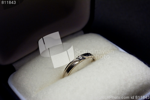 Image of thin white gold ring with diamond