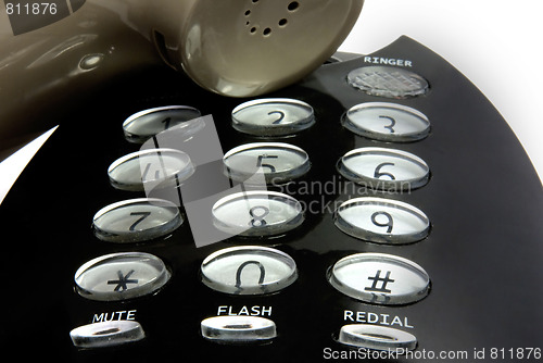 Image of digits and speaker of a black telephone