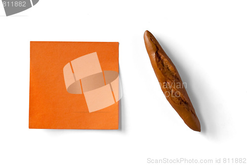 Image of orange sticky note and figure of french loaf isolated on white