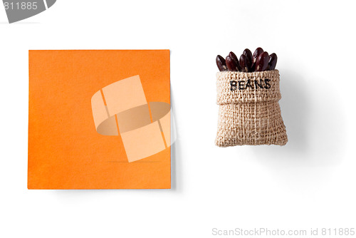 Image of sticky note and beans in a packet