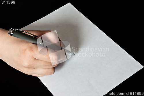 Image of woman writing on a blank sheet of paper