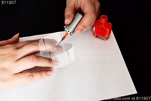 Image of woman manicuring her nails