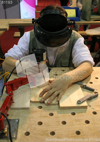 Image of Man using power tool