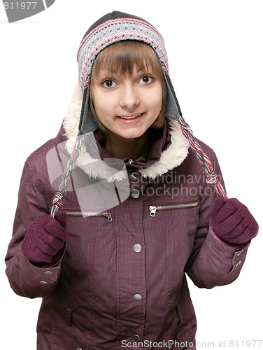 Image of Young beautiful girl in winter to jacket and hat
