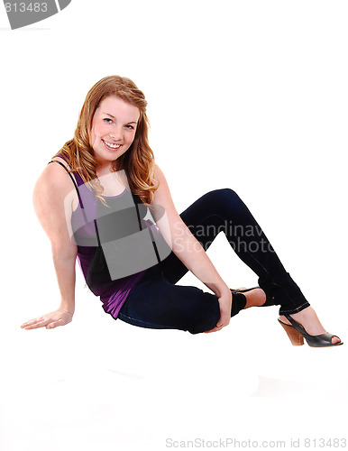 Image of Girl sitting on floor. 