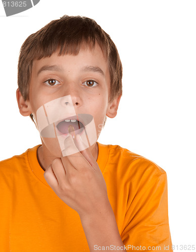 Image of boy taking a pill