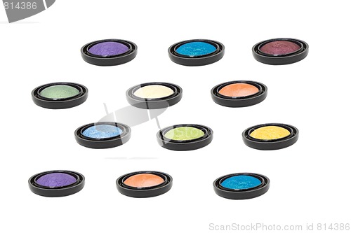 Image of nine colored eyeshadows isolated in white