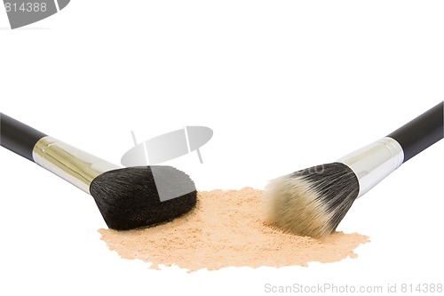 Image of two make-up brushes with powder isolated 