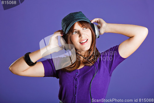 Image of Beautiful woman listening music