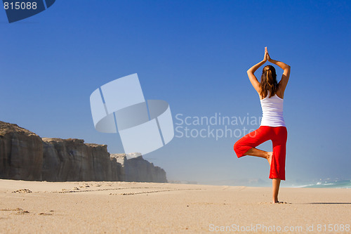 Image of Young woman making Yoga