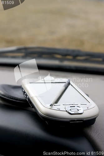 Image of PDA - Palm on the deck of the car