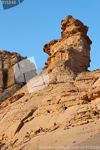 Image of Weathered rock finger in stone desert