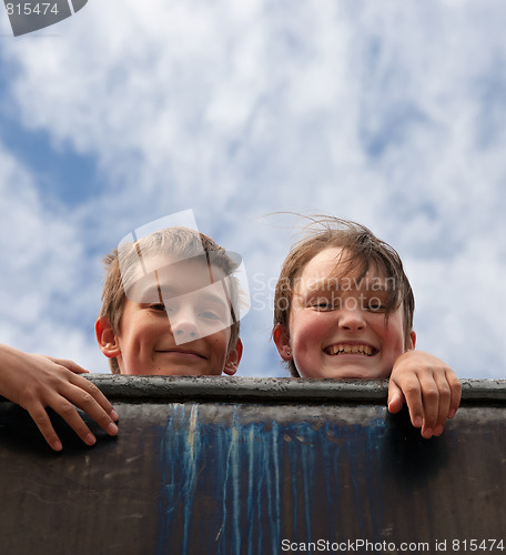 Image of brother and sister on wall