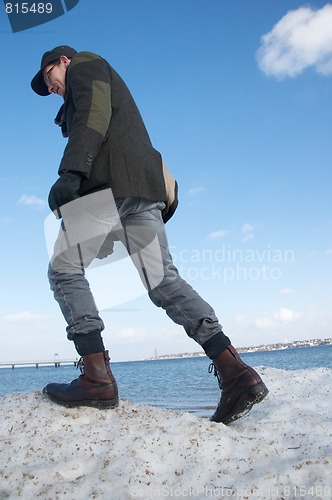 Image of man walking on snow