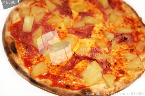 Image of Delicious pizza - pineapple, ham, salami 