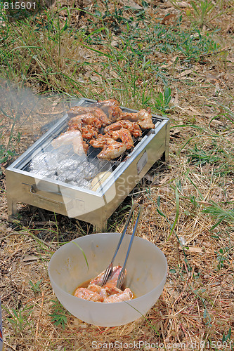 Image of BBQ. Close up photo of cooking meet on the open fire