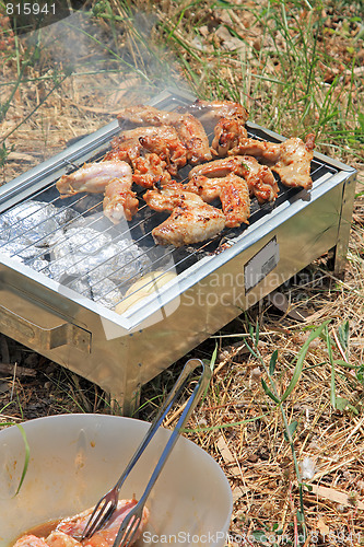 Image of BBQ. Close up photo of cooking meet on the open fire