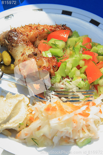 Image of BBQ. Grilled chicken on the white plate