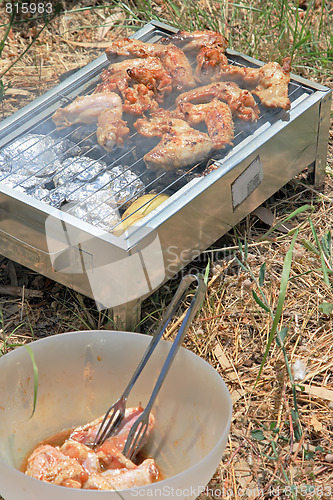 Image of BBQ. Close up photo of cooking meet on the open fire