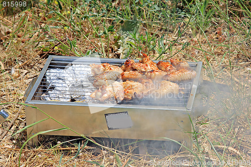 Image of BBQ. Close up photo of cooking meet on the open fire