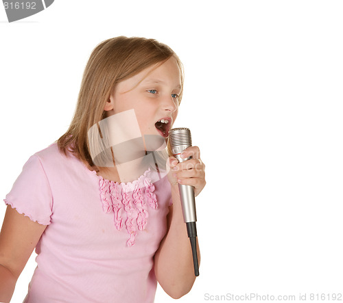 Image of young girl singing karaoke on white