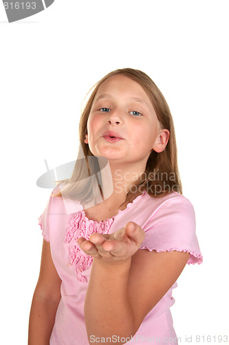 Image of a young girl blowing a kiss