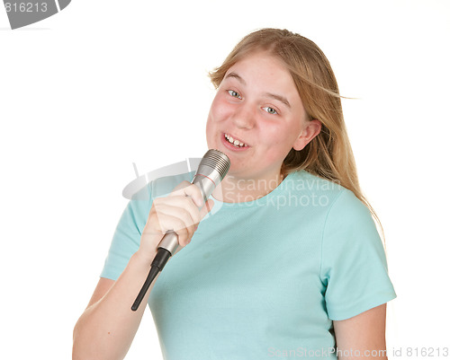 Image of teenage girl singing karaoke