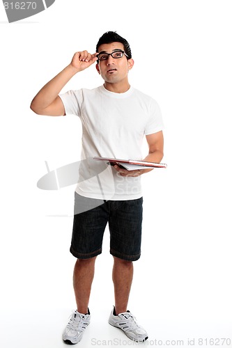 Image of Man with a notepad and pen looking up