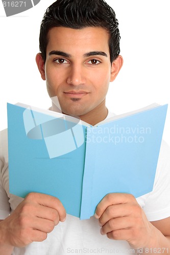 Image of Man looking up from an open book