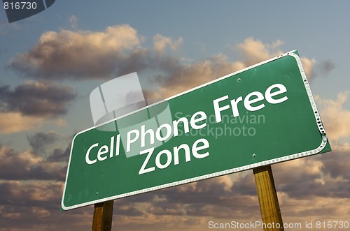 Image of Cell Phone Free Zone Green Road Sign and Clouds